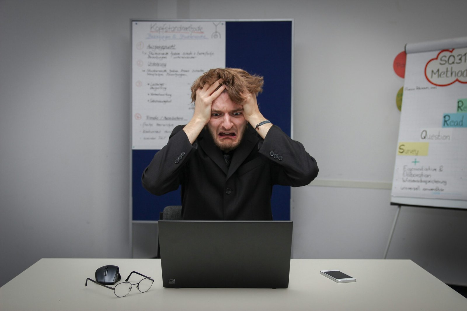 paid ads for beginners guide showing small business owner frustrated with online advertising results
